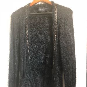 Mink Pink black faux fur sweater with gold chain